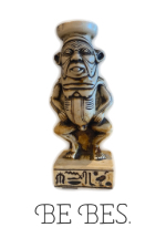 An ugly little statuette of the Egyptian god Bes is shown, with the words BE BES beneath